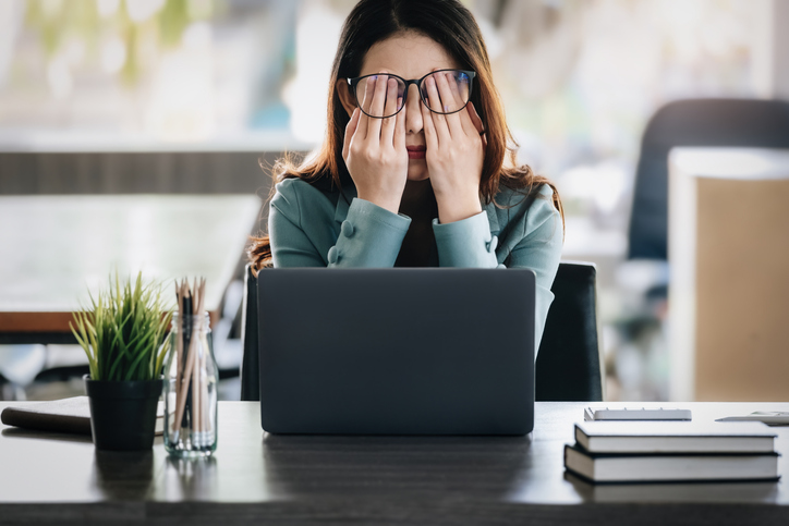 Concept Burnout Syndrome. Business Woman feels uncomfortable working. Which is caused by stress, accumulated from unsuccessful work And less resting body.